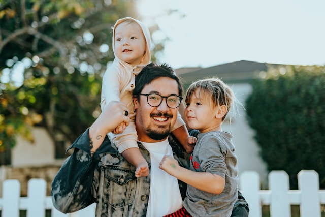 A parent with two children